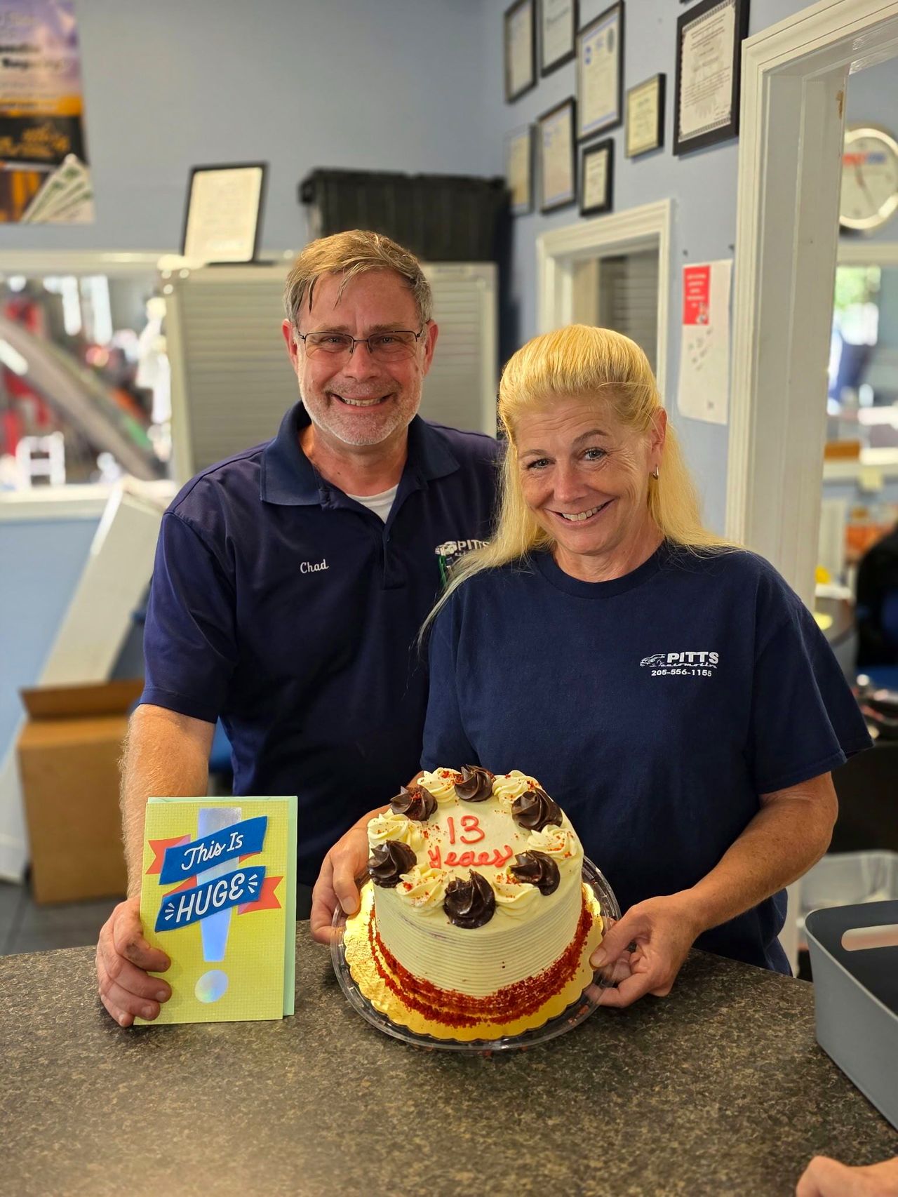 Chad and Maggie Pitts behind the counter on the shop's anniversary